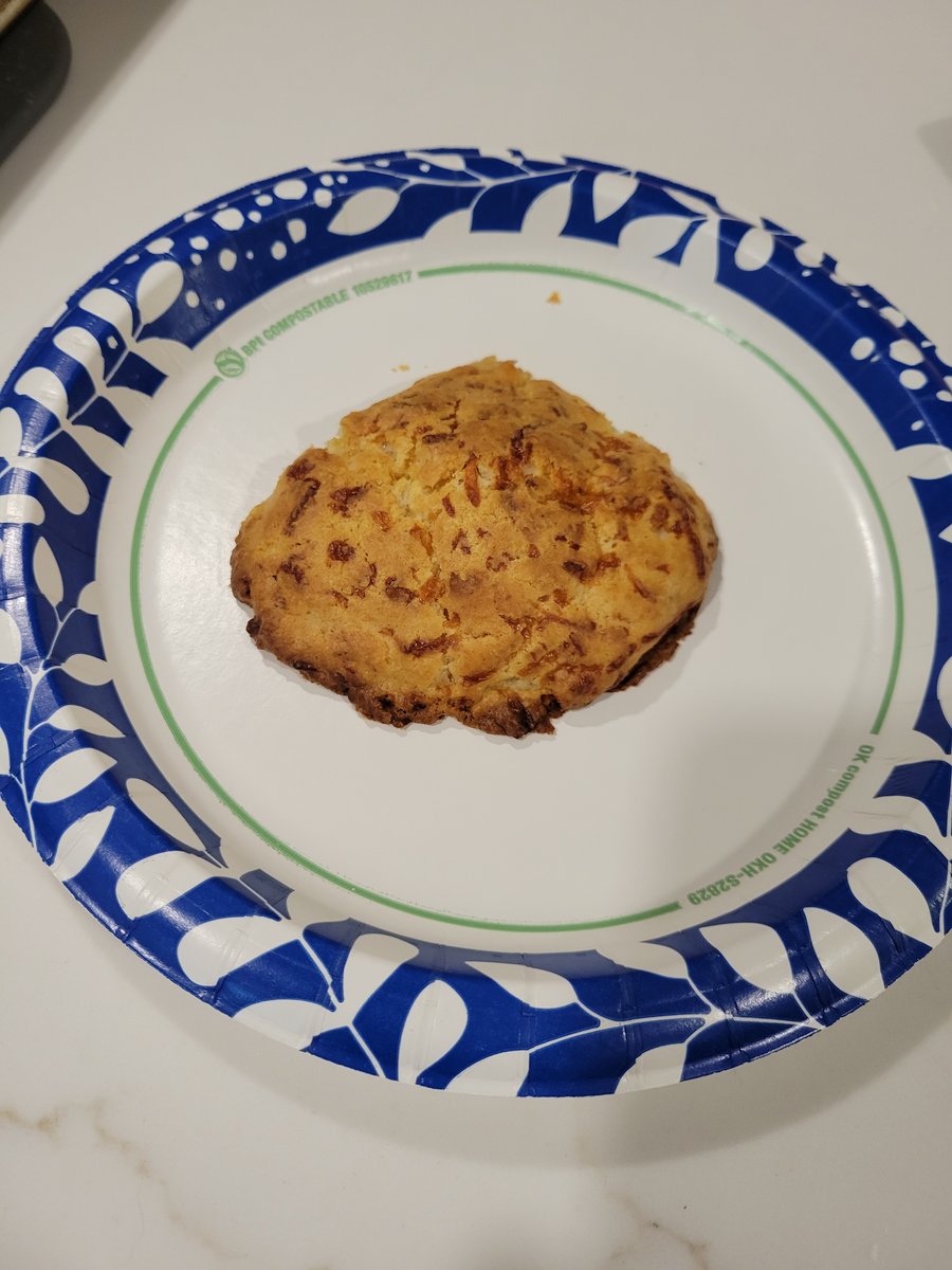 Golden cheesy garlic biscuits glistening with garlic butter on a baking sheet