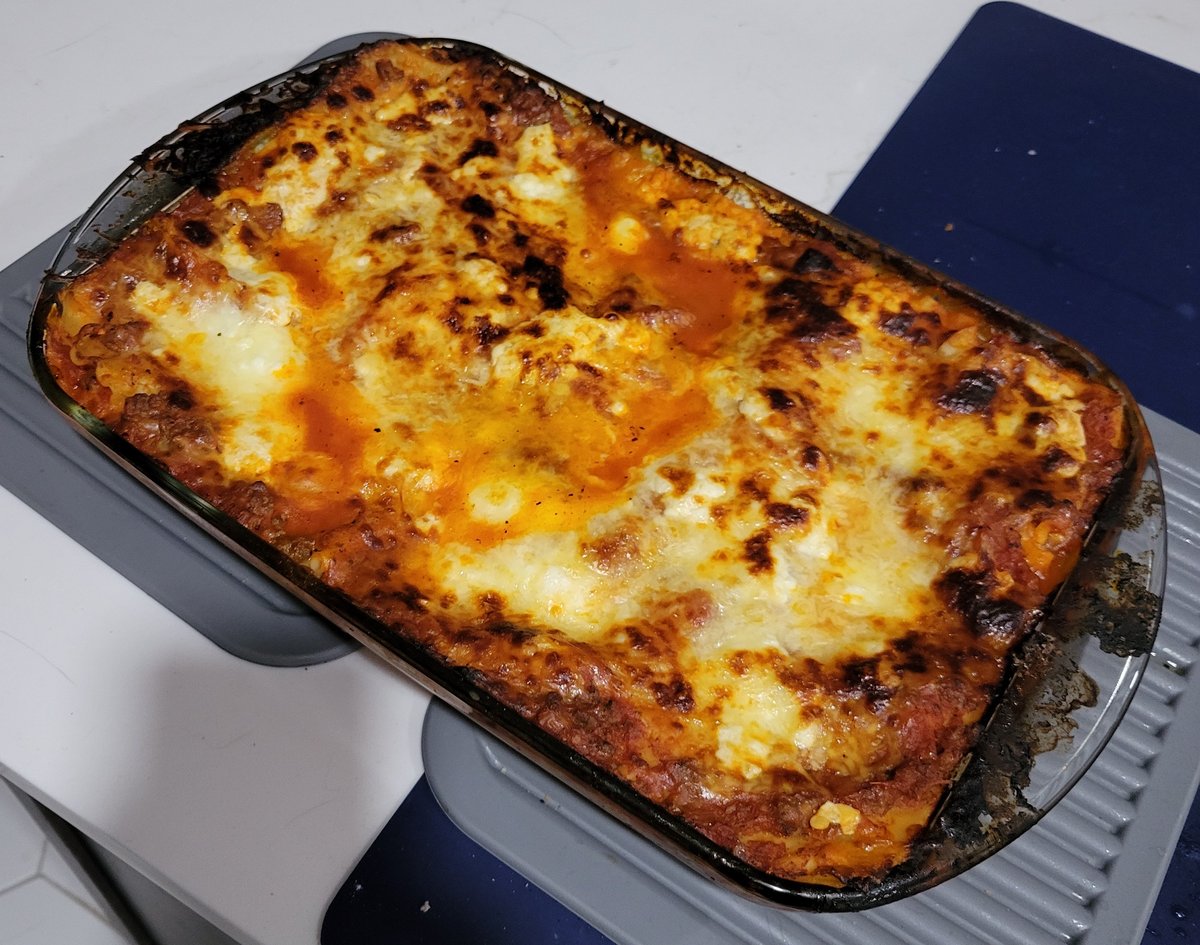 Casey's Family Lasagna - golden brown cheese on top, layers of meat sauce and cottage cheese visible